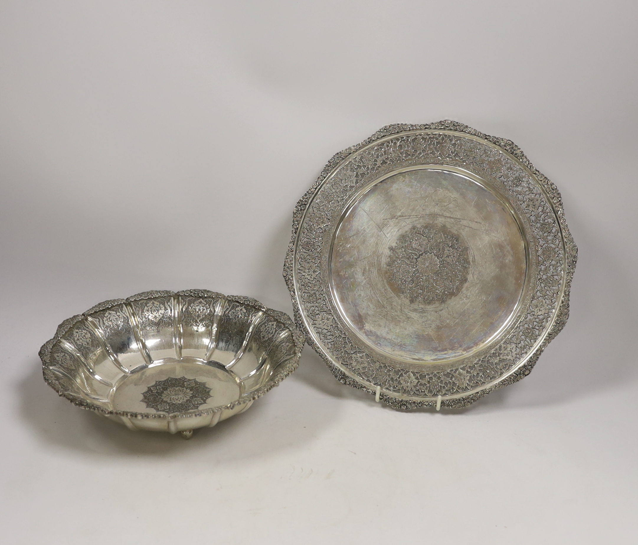 A Persian engraved white metal (stamped 84) fruit bowl, diameter 23cm and a similar pierced dish, 34.4oz.